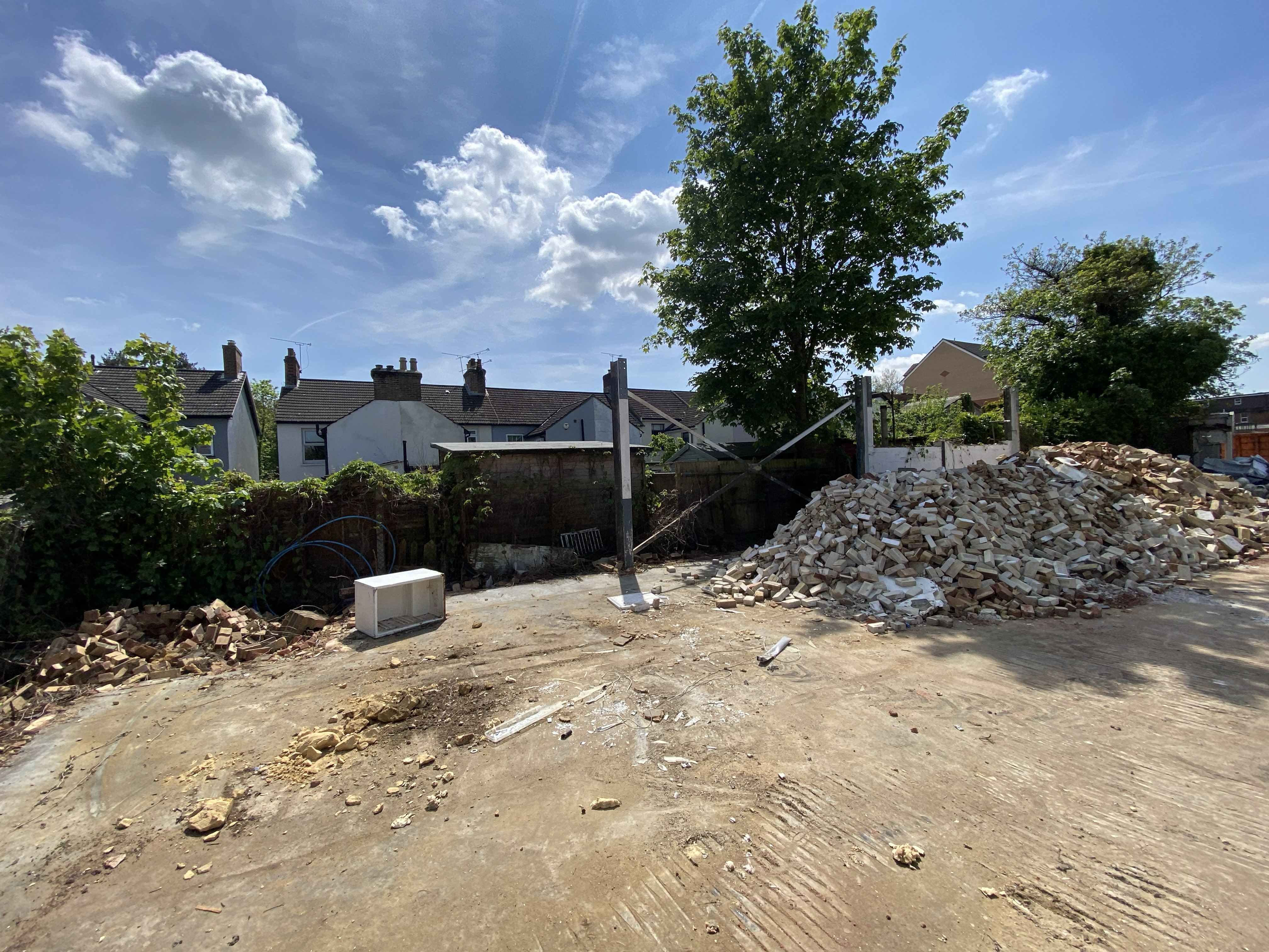 Demolition rear site rubble boundary fence